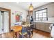 Charming kitchen with wood table, updated appliances, and an abundance of natural light at 244 Ashley Ave, Charleston, SC 29403