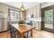 Eat-in kitchen features a dining table, stainless steel appliances, and ample counter space at 244 Ashley Ave, Charleston, SC 29403