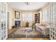 Charming living room with fireplace, built-in bookcase, and plenty of natural light at 244 Ashley Ave, Charleston, SC 29403