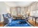 Comfortable living room featuring large windows, hardwood floors, and stylish furniture arrangements at 244 Ashley Ave, Charleston, SC 29403