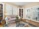Cozy living room with built-in bookshelves, shuttered windows, and stylish decor at 244 Ashley Ave, Charleston, SC 29403