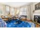 Elegant living room with period details including a fireplace and bright natural light at 244 Ashley Ave, Charleston, SC 29403