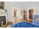 Well-lit living area featuring a fireplace and multiple doorways leading to other rooms at 244 Ashley Ave, Charleston, SC 29403