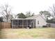 Backyard view with a screened-in porch at 2590 Otranto Rd, North Charleston, SC 29406