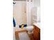 Bathroom with shower-tub combo, wood cabinet sink, and tile floors at 2590 Otranto Rd, North Charleston, SC 29406