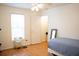 Bedroom features natural light, single bed, and scale at 2590 Otranto Rd, North Charleston, SC 29406