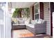 Inviting front porch with comfortable seating and a decorative rug, perfect for relaxation at 2590 Otranto Rd, North Charleston, SC 29406
