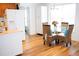 Bright eat-in kitchen featuring a glass top table and bright white appliances at 2590 Otranto Rd, North Charleston, SC 29406