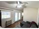 Bright living room showcasing natural light, a modern ceiling fan, and a cozy gray sofa at 2590 Otranto Rd, North Charleston, SC 29406