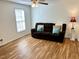 Inviting living room featuring a comfortable brown sofa and modern ceiling fan for a relaxing ambiance at 2590 Otranto Rd, North Charleston, SC 29406