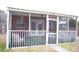Screened porch features outdoor furniture and fan at 2590 Otranto Rd, North Charleston, SC 29406