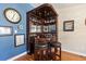 Charming bar area featuring a built-in cabinet, stylish stools, and unique wall decor, perfect for entertaining guests at 264 Fair Sailing Rd # 42, Mount Pleasant, SC 29466