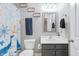 Nautical-themed bathroom featuring stylish vanity with sink and mirror, framed decor, and a coordinated shower curtain and towels at 267 Cameron St, Summerville, SC 29486