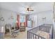 Bedroom includes a crib, a rocker/glider and a dresser with modern and comfortable design at 267 Cameron St, Summerville, SC 29486