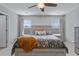 Bright bedroom with large bed, ceiling fan, two windows with blinds, and light neutral colors at 267 Cameron St, Summerville, SC 29486
