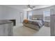 Spacious bedroom features a bed, a ceiling fan, two windows with blinds and two dressers at 267 Cameron St, Summerville, SC 29486