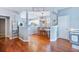 Open-concept dining room connected to the kitchen with beautiful hardwood floors, and plenty of natural light at 267 Cameron St, Summerville, SC 29486