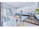 Bright kitchen with stainless steel appliances, granite countertops, white cabinets, and an island at 267 Cameron St, Summerville, SC 29486