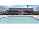 Community clubhouse and pool featuring a covered seating area, well kept shrubbery, and a secured gated fence at 267 Cameron St, Summerville, SC 29486