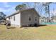 Exterior view of home with well-maintained backyard and deck, offering outdoor enjoyment at 2969 Bobo Rd, Mount Pleasant, SC 29466