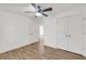 Bedroom with hardwood floors, a ceiling fan, a closet with plenty of storage, and an interior door at 2969 Bobo Rd, Mount Pleasant, SC 29466