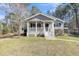 A view of the home with an inviting front porch and tidy yard at 2969 Bobo Rd, Mount Pleasant, SC 29466