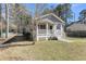 Charming home with a covered front porch and a well-maintained lawn surrounded by mature trees at 2969 Bobo Rd, Mount Pleasant, SC 29466