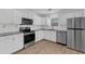 Modern kitchen featuring stainless steel appliances, granite countertops, and white cabinets at 2969 Bobo Rd, Mount Pleasant, SC 29466
