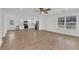 Bright, open-concept living room with modern wood flooring and abundant natural light at 2969 Bobo Rd, Mount Pleasant, SC 29466