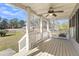 Inviting covered porch featuring a ceiling fan and ample space for relaxing at 2969 Bobo Rd, Mount Pleasant, SC 29466