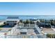 Panoramic aerial view showcasing oceanfront homes and a rooftop deck with ocean views at 3030 Marshall Blvd, Sullivans Island, SC 29482