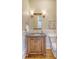 Powder bath with single vanity, granite countertop, and decorative sconces at 3030 Marshall Blvd, Sullivans Island, SC 29482