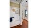 Entryway with storage bench and view of the ocean from the adjacent room at 3030 Marshall Blvd, Sullivans Island, SC 29482
