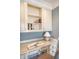 Cozy home office with custom built-ins, display shelving, and ample counter space for a productive workspace at 3030 Marshall Blvd, Sullivans Island, SC 29482