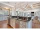Open concept kitchen with stainless appliances, granite countertops, and coffered ceiling at 3030 Marshall Blvd, Sullivans Island, SC 29482