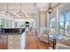 Open kitchen view to living room and backyard boasting a granite countertop and stainless steel appliances at 3030 Marshall Blvd, Sullivans Island, SC 29482