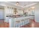 Kitchen with island, seating, stainless appliances, custom cabinets, granite countertops at 3030 Marshall Blvd, Sullivans Island, SC 29482