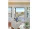 Bright living room with ocean view, white furnishings, and a coastal aesthetic at 3030 Marshall Blvd, Sullivans Island, SC 29482