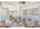 Spacious living area with white wainscoting, office nook, and light-filled windows at 3030 Marshall Blvd, Sullivans Island, SC 29482