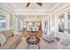 Spacious living area offering lots of natural light, hardwood floors, and an open design to the kitchen at 3030 Marshall Blvd, Sullivans Island, SC 29482