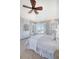 Light-filled bedroom featuring built-in cabinets, plush carpet, and an ocean view at 3030 Marshall Blvd, Sullivans Island, SC 29482