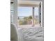 Main bedroom view to balcony, showcasing coastal scenery and bright, airy design at 3030 Marshall Blvd, Sullivans Island, SC 29482