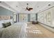 Spacious main bedroom with vaulted ceilings, plantation shutters, and a ceiling fan at 3030 Marshall Blvd, Sullivans Island, SC 29482