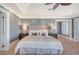 Inviting main bedroom featuring a tray ceiling, plush carpeting, and stylish decor at 3030 Marshall Blvd, Sullivans Island, SC 29482