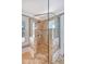 A modern, glass-enclosed shower with a tiled surround and mosaic accent creates a luxurious bathroom experience at 3030 Marshall Blvd, Sullivans Island, SC 29482
