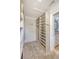 Spacious walk-in closet with custom shelving and hanging rods provides ample storage and organization at 3030 Marshall Blvd, Sullivans Island, SC 29482