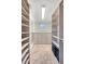 Custom walk-in closet with built-in shelves and drawers offers ample storage and organization at 3030 Marshall Blvd, Sullivans Island, SC 29482