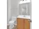 Well-lit bathroom featuring a vanity with a wood cabinet, a mirror, and a toilet in a neutral color scheme at 3049 Park West Blvd, Mount Pleasant, SC 29466