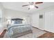 Comfortable bedroom featuring neutral colors, a ceiling fan, and double-door closet at 3049 Park West Blvd, Mount Pleasant, SC 29466