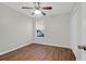 Clean, neutral bedroom featuring wood-look flooring, a ceiling fan, and a window overlooking the outdoors at 3049 Park West Blvd, Mount Pleasant, SC 29466